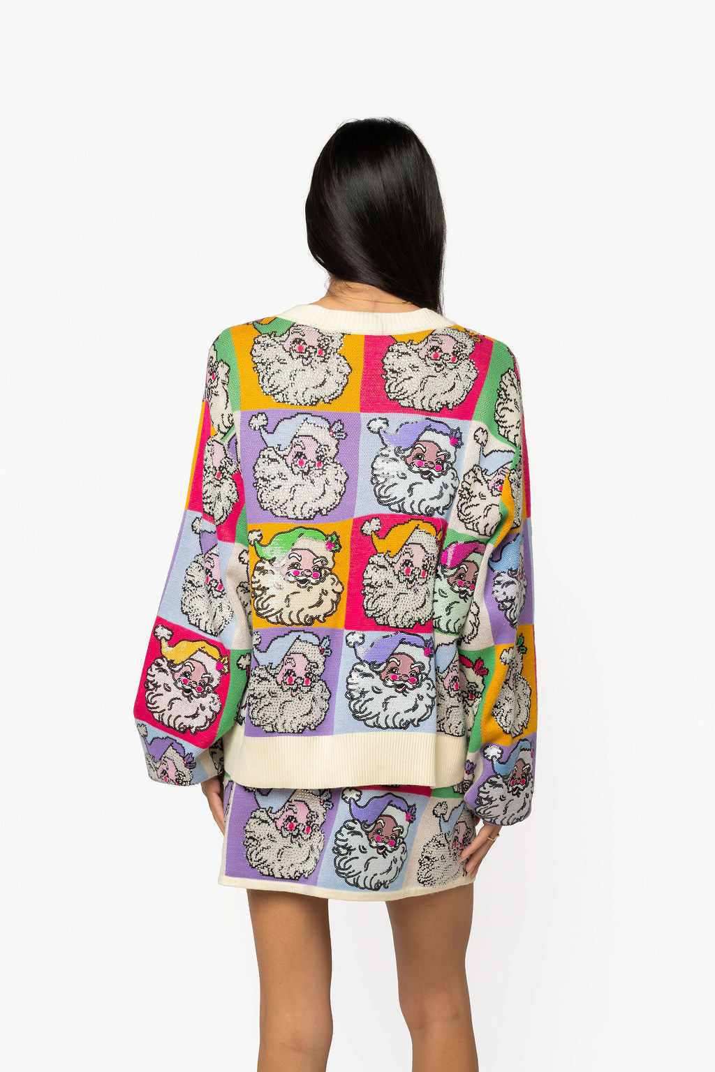 Back view of Queen of Sparkles Pastel Colorblock Santa Cardigan with colorful Santa design