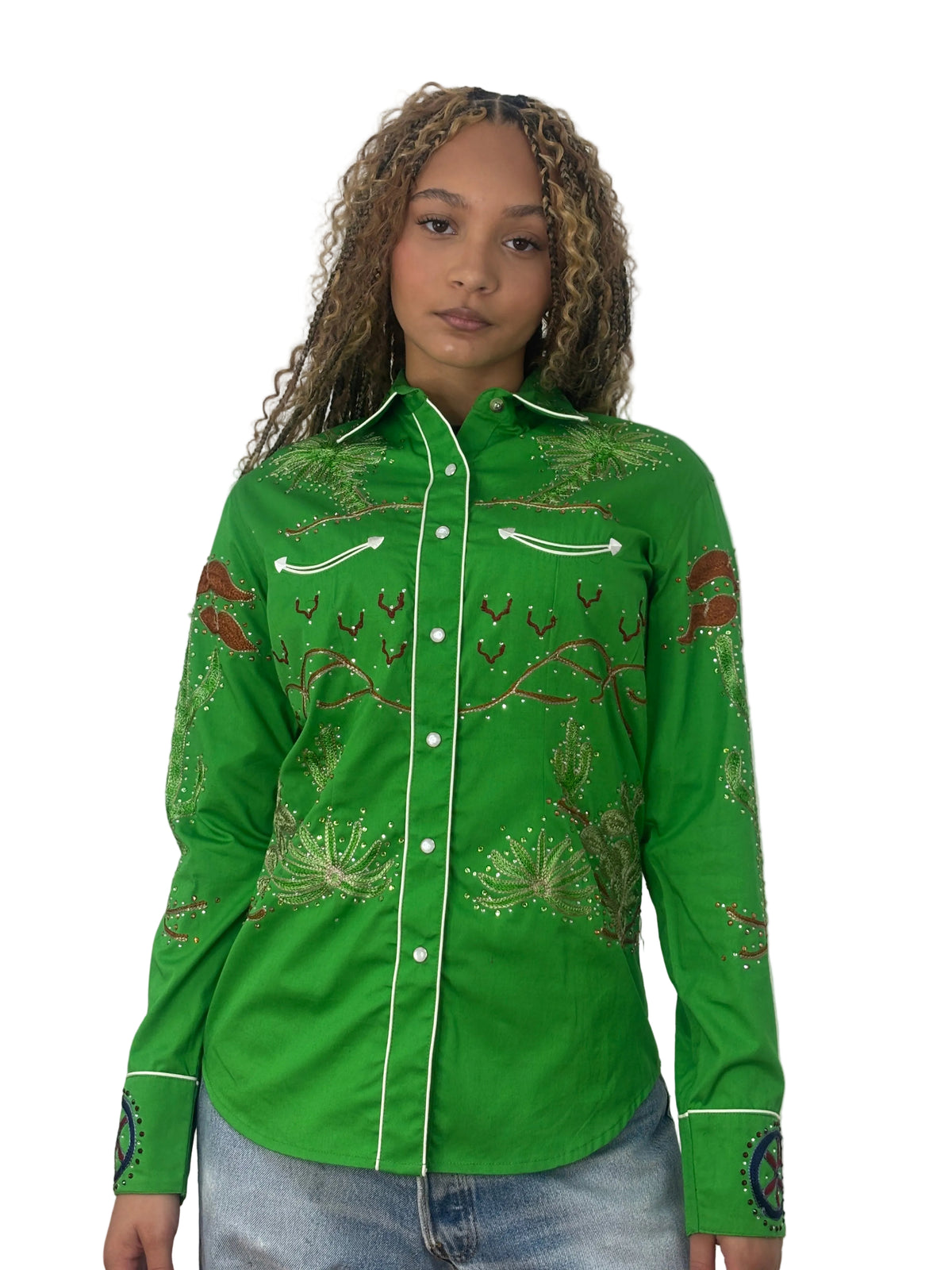 Front view of a model wearing the bright green Rockmount Porter Wagoner shirt with rhinestone designs and white piping