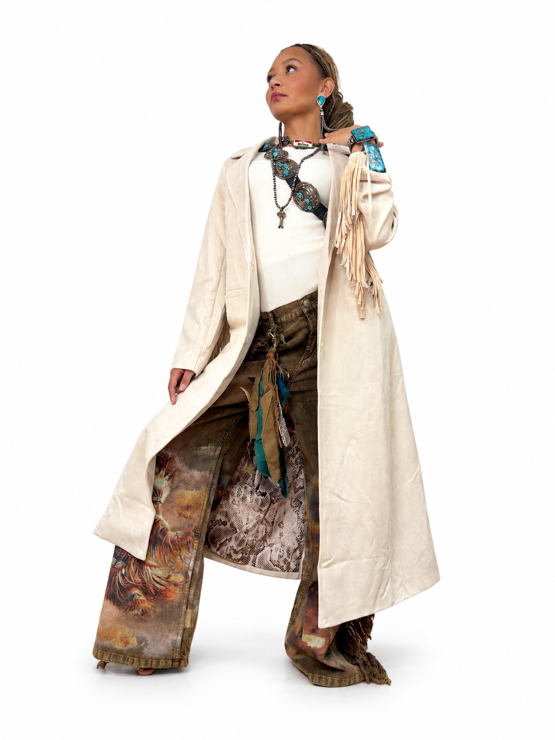 Model wearing a long ivory Skies are Blue faux suede fringe duster.