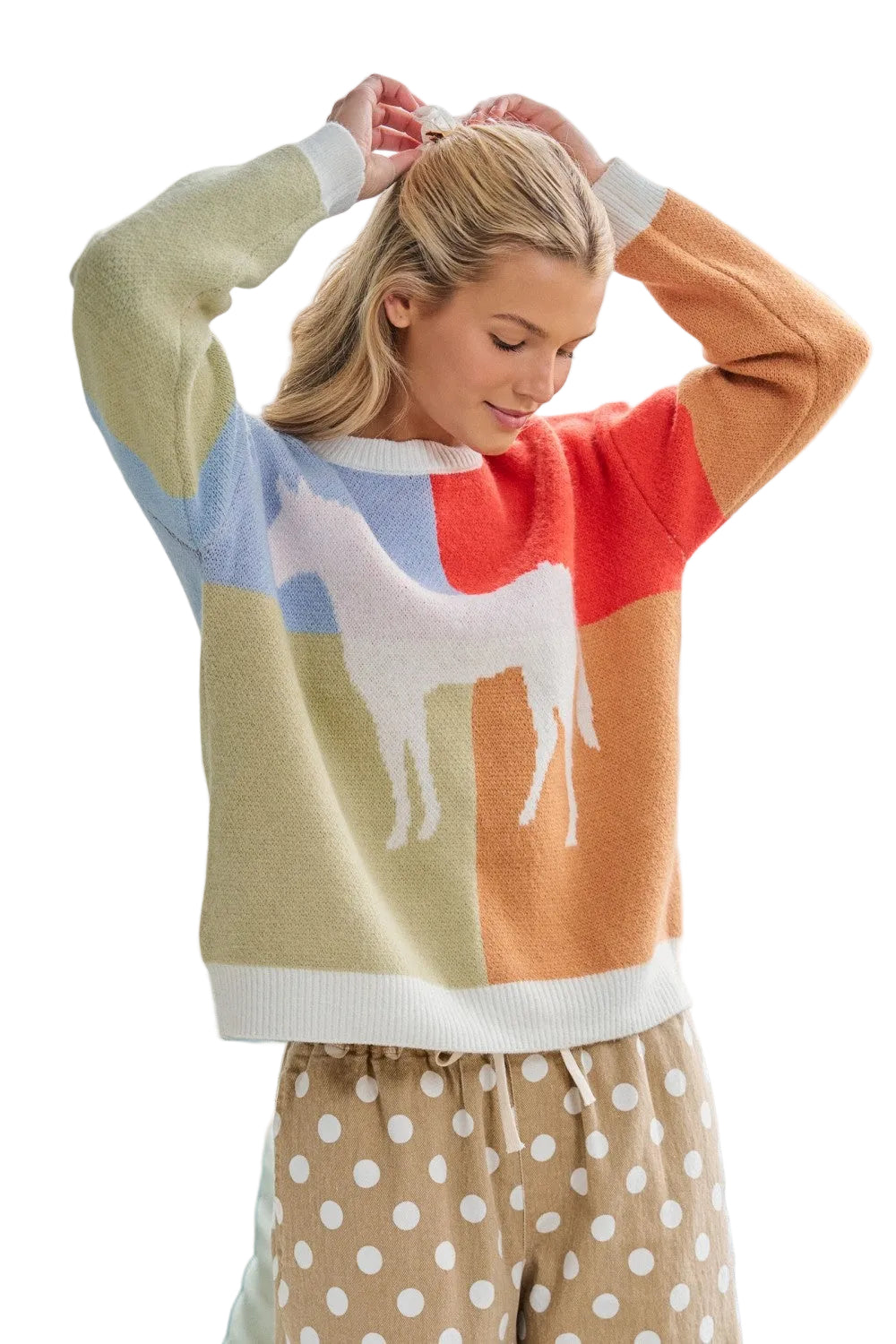 Front view of pastel sage, pale blue, cream, coral and orange colorblock sweater with a horse graphic