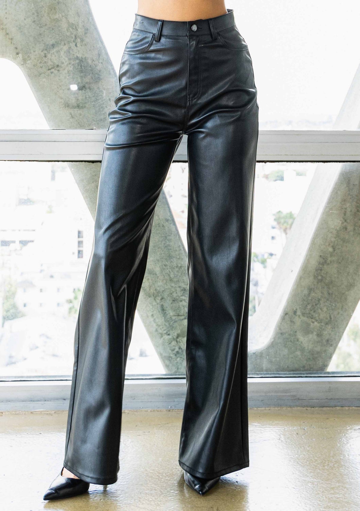 Black faux leather  high-waisted wide-leg pants for women close up view 