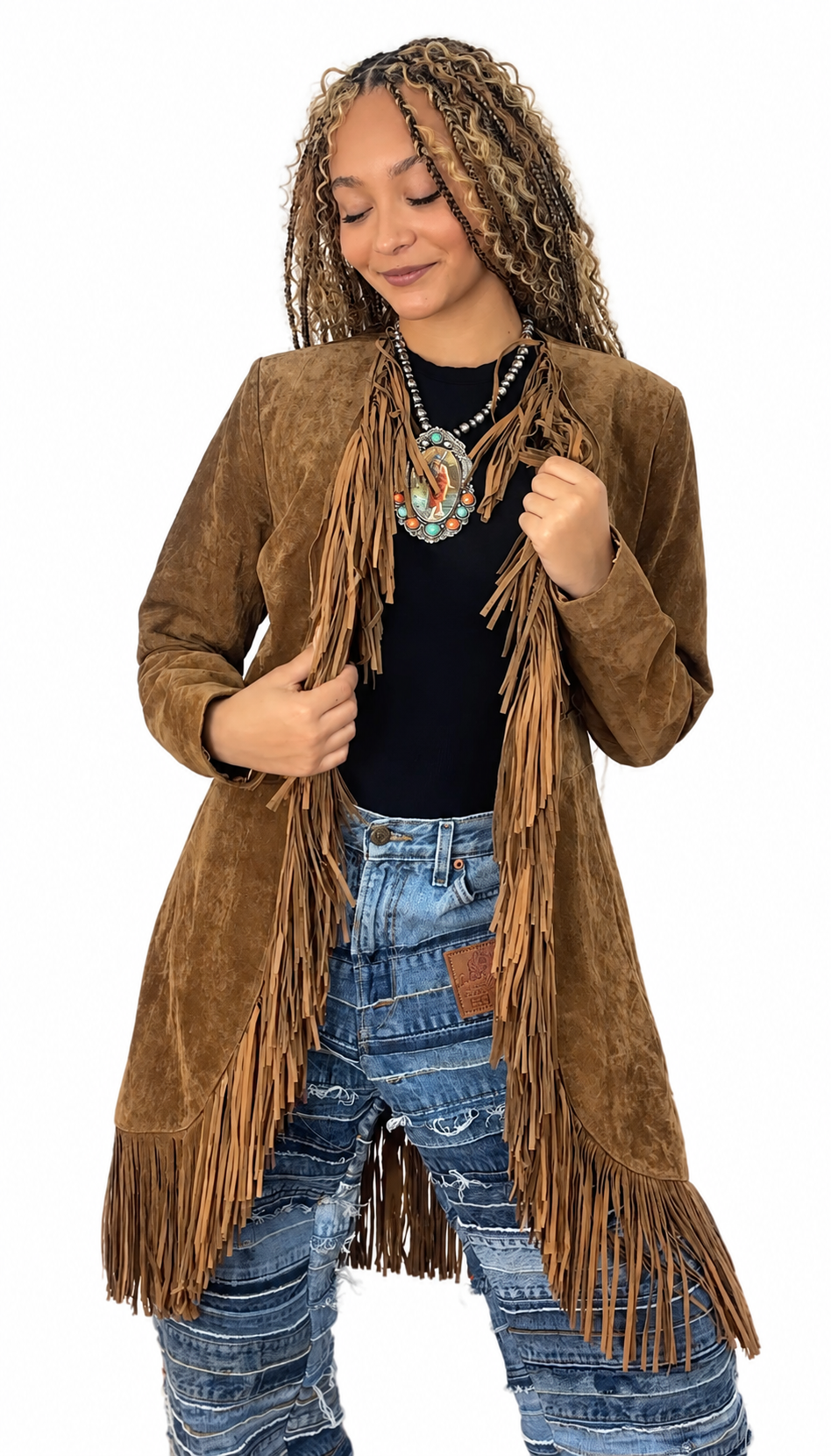Model wearing a brown Scully soft suede fringe coat with long fringe down the front and hem.