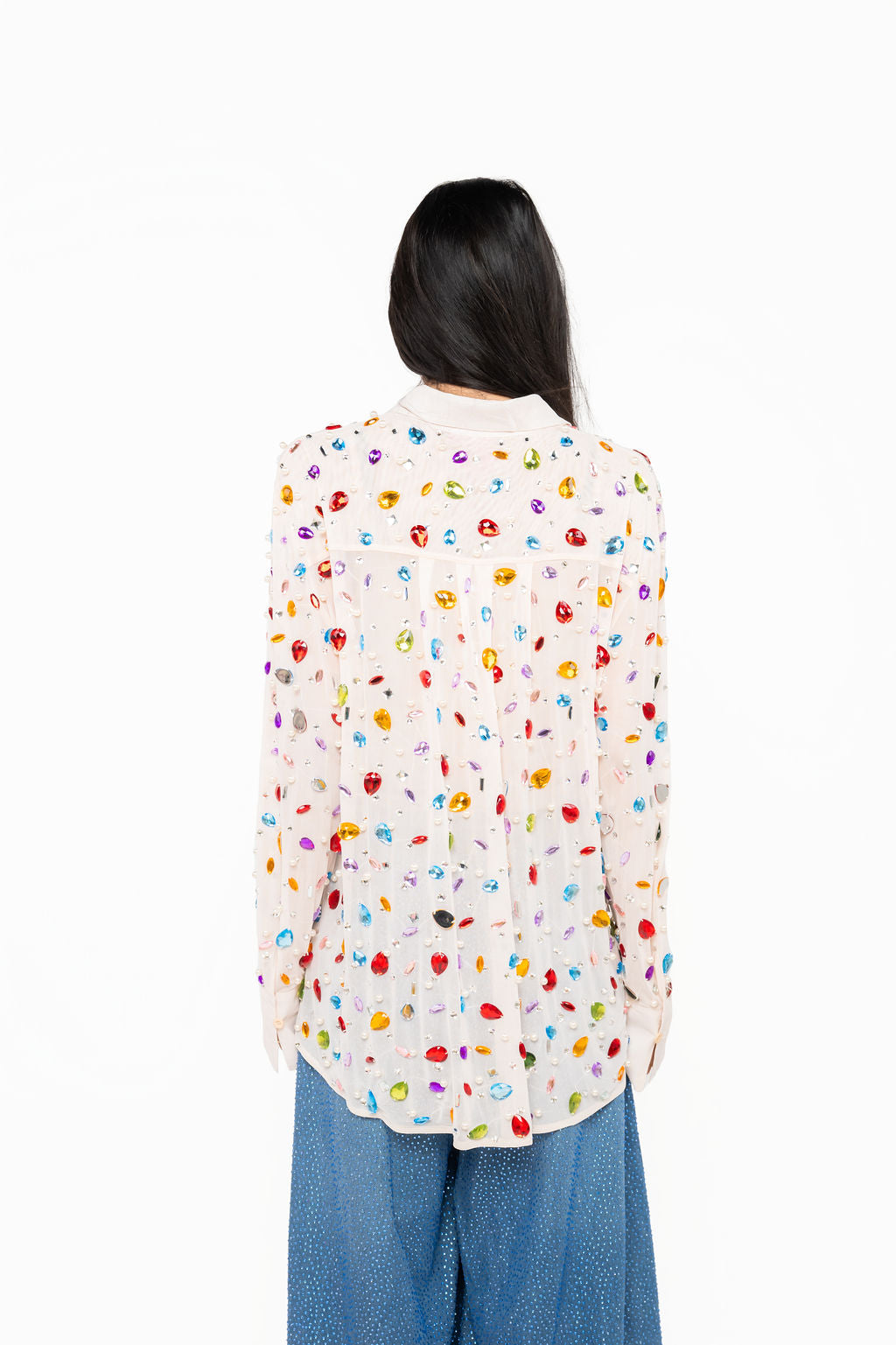 Back view showing colorful jewel and pearl embellishments across the sheer white Queen of Sparkles button-up top.