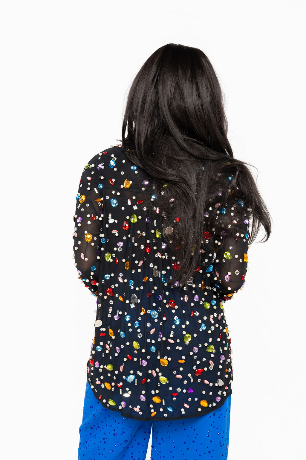 Back of Queen of Sparkles black top covered in multicolor jewels and pearl embellishments