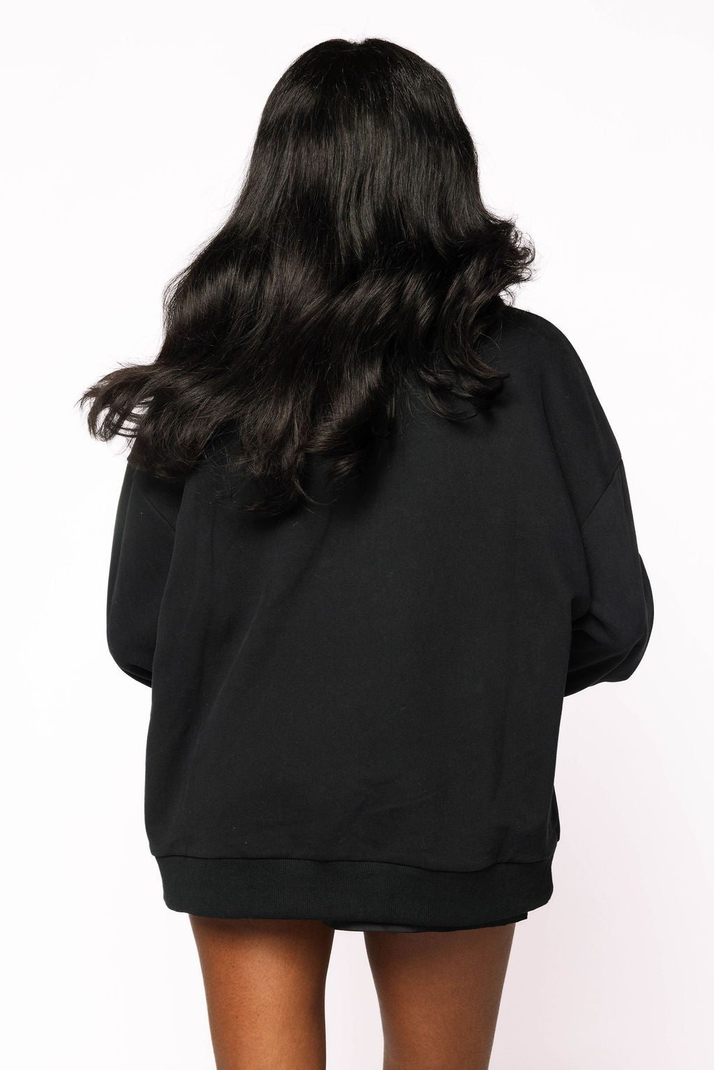 Back view of a model wearing the Queen of Sparkles black sweatshirt, showing the plain back without a pumpkin motif.
