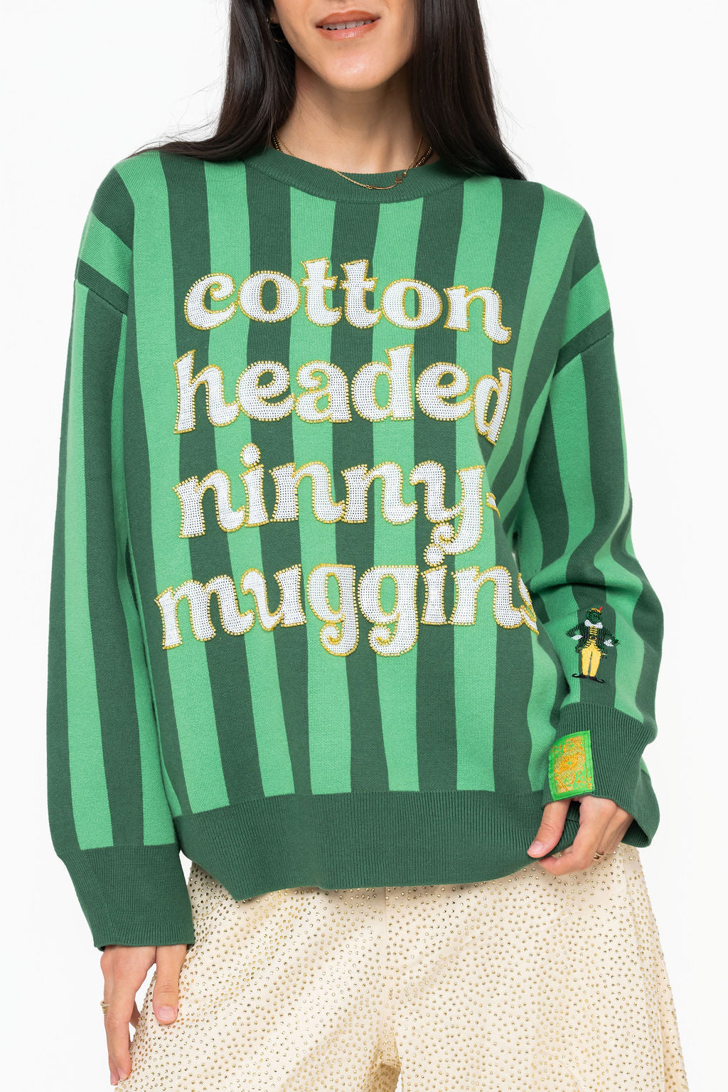 Front view of Queen of Sparkles green striped Elf Cotton Headed Ninny Muggins sweater with a Buddy-inspired sleeve detail.