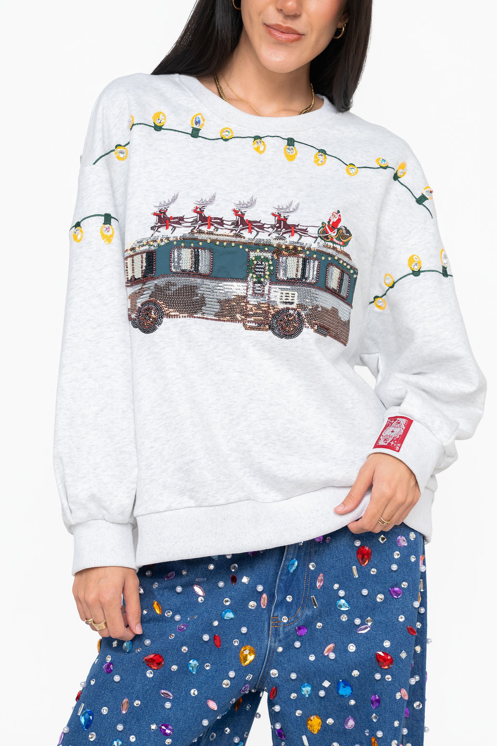 Queen of Sparkles gray sweatshirt featuring a sequin and beaded Cousin Eddie RV with Santa, reindeer, and yellow Christmas lights.