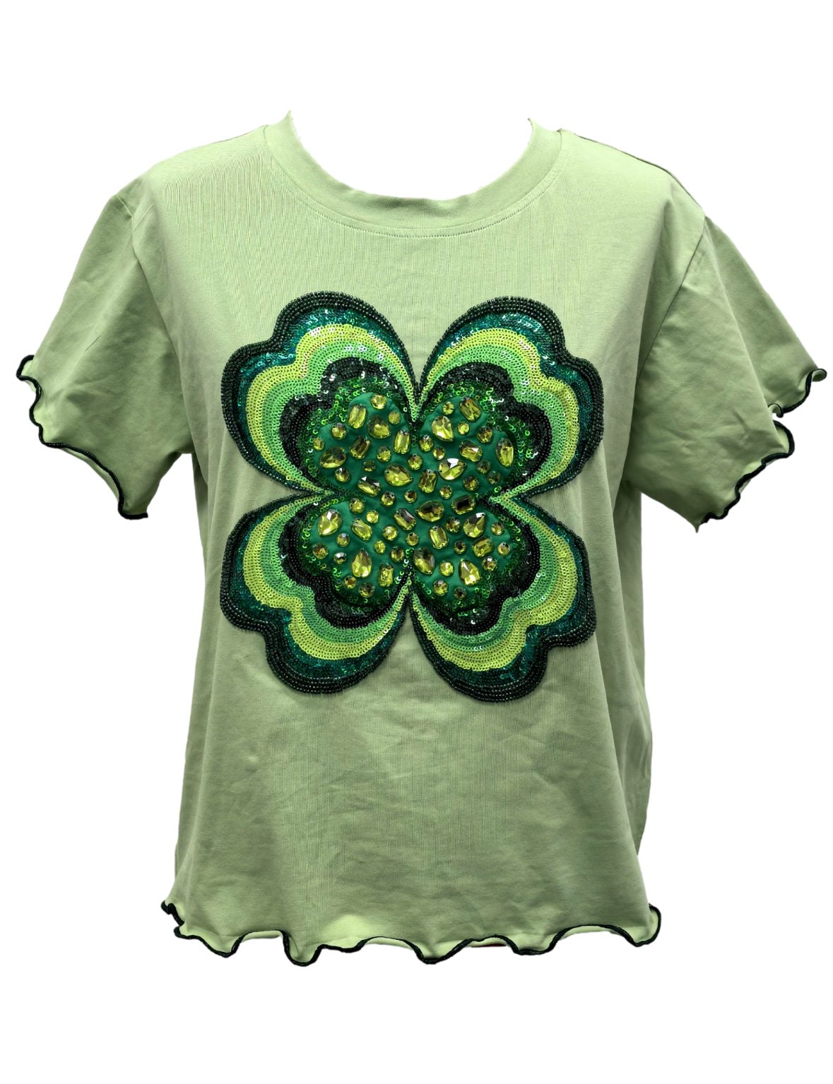 Front product view of the light green short-sleeve top with a large green embellished shamrock and frilly edges, on a white background.