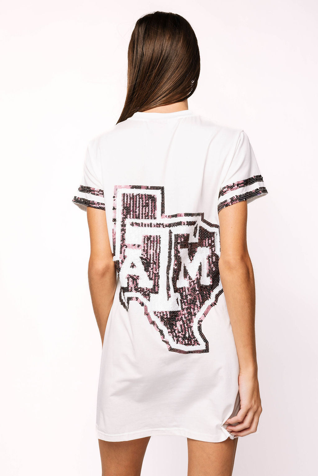 Back view of the white Queen of Sparkles Texas A&M oversized tee dress, showing the large black sequin Texas A&M graphic and striped sleeve bands.