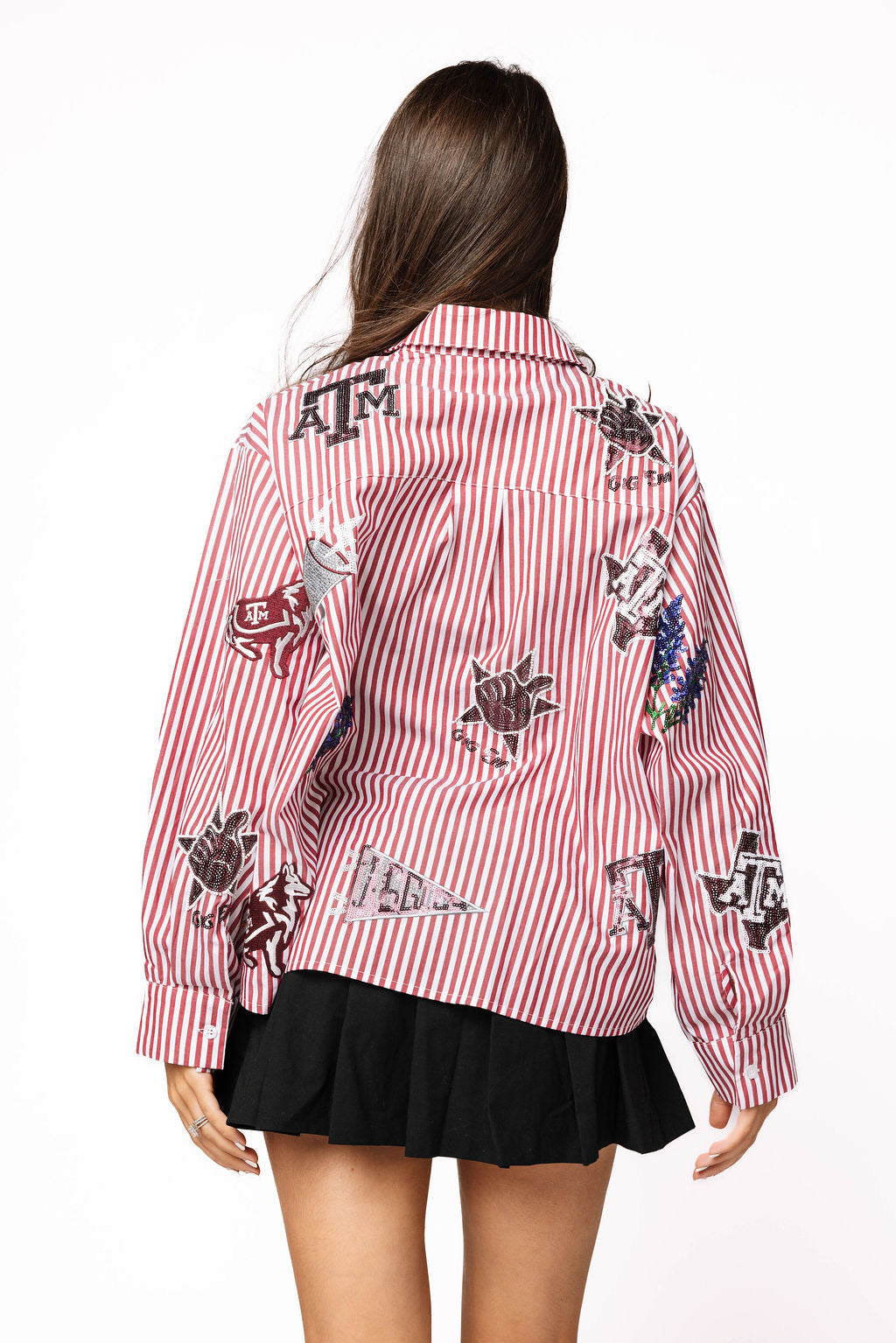 Back view of the red-and-white striped Queen of Sparkles Texas A&M button-down, showing scattered Aggies icons across the shirt.