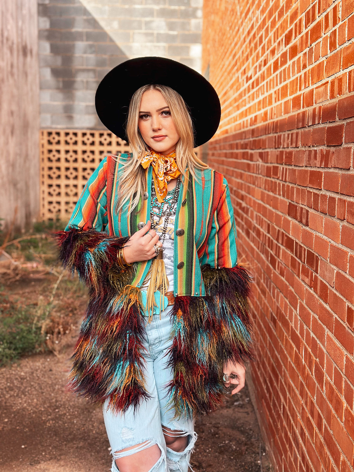 Silverado Apparel Tess Sundance Multi Llama Jacket featuring colorful Southwest stripes and dramatic shaggy sleeves