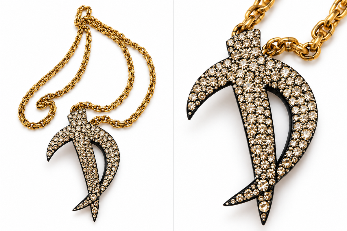 One-of-a-kind vintage gold-tone chain necklace featuring a repurposed sculptural rhinestone brooch pendant.