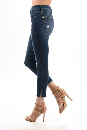 dark blue distressed denim with side slit and raw hem springtime stretch jean